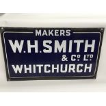 A vintage enamel sign for W H Smith & Co Ltd. Whit