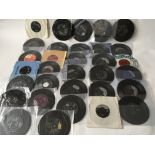 A collection of 7inch singles and EPs by various artists including The Beatles, Elvis Presley, Roy