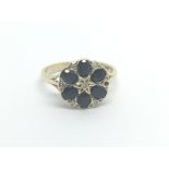 A 9carat gold ring set with a pattern of six sapph