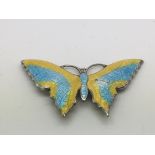 A vintage sterling silver and enamel butterfly bro