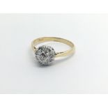 An 18carat gold ring set with a cluster of diamonds ring size L-M