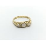 A 1950s 18carat gold ring set with Opals ring size
