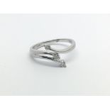 A 9carat white gold modern design ring set with three diamonds ring size N.