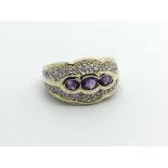 A 9carat gold ring set with three amethyst with a