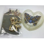 A circa 1930s large butterfly brooch set with blue stones plus three other butterfly brooches.