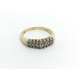 An 18carat gold ring set with two rows of diamonds