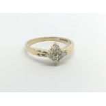 An 18carat gold ring set with a pattern of brillia
