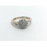 A 9carat gold ring set with a Cluster pattern Of d