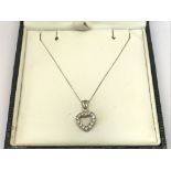 A 9ct white gold heart pendent on white gold chain