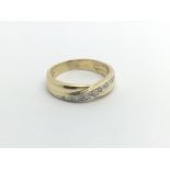 A 9carat gold ring set with a pattern of diamonds ring size I.