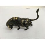 A 1920s small bronze figure in the form of a bull.
