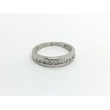 An 18carat white gold ring set with a row of brill