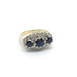 An 18carat gold ring set with three sapphire and a
