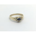 An unmarked gold ring possible 18carat set with a