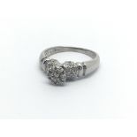 A Platinum ring set with a pattern of diamonds ring size P-Q.