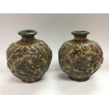 A pair of Persian vases of ovoid form and having f