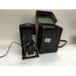 A vintage Thornton and Pickard plate camera and case with additional plates.
