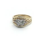 A 14carat gold ring set with a pattern of diamonds