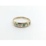 A Vintage 18carat gold ring set with emerald and d