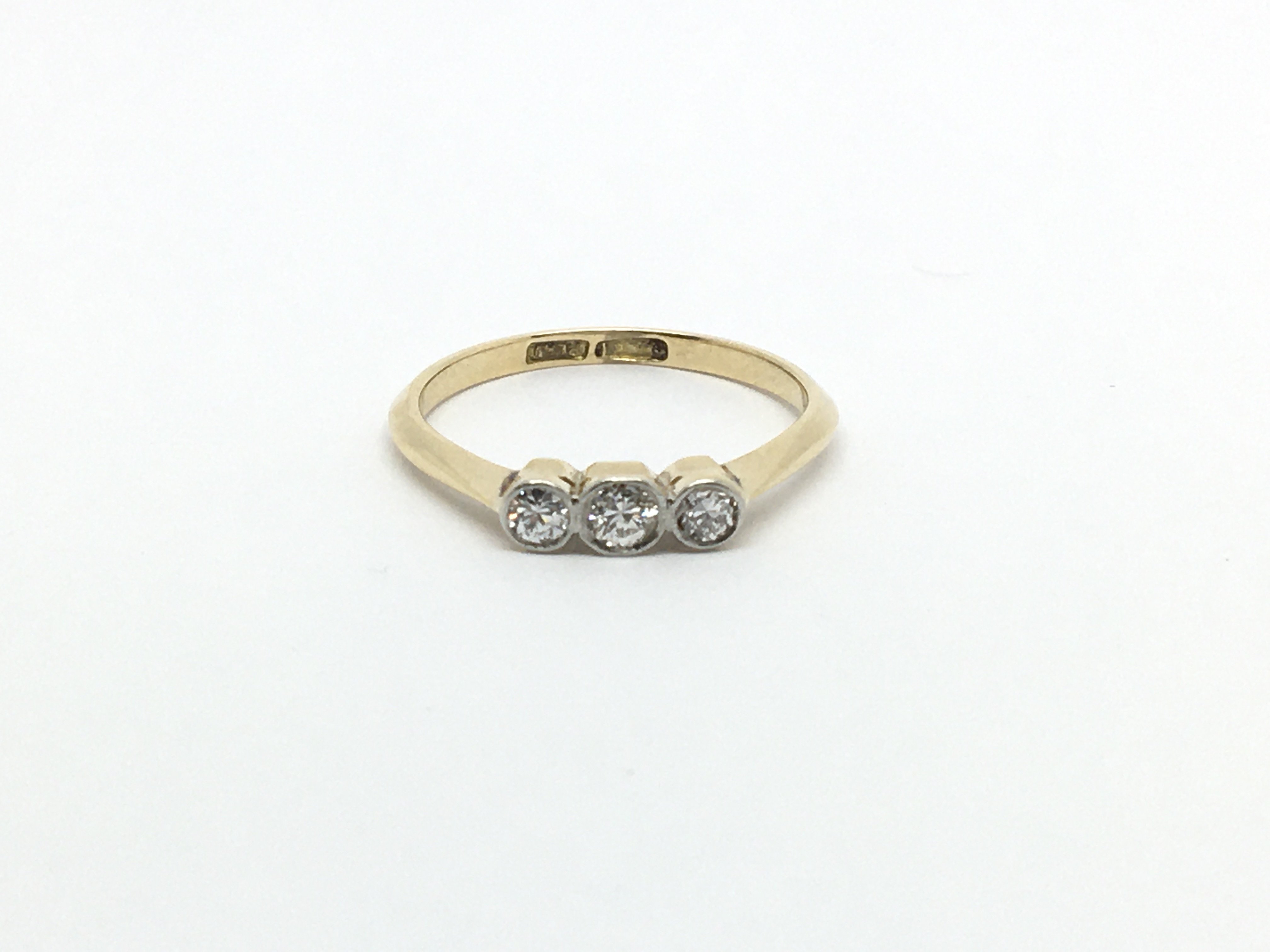 A Vintage 18carat gold ring set with three diamond