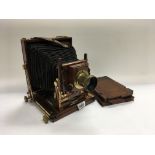 A mahogany half and quarter plate camera by Thornton Pickard.