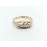 An 18carat gold ring set with a row of diamonds ri