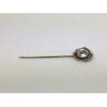 A Victorian plated metal and paste stickpin.