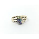 A 9carat gold ring set with multiple coloured stones ring size N.