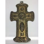 An unusual gilt metal cross pendant inset with the