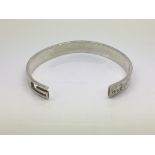 A sterling silver bracelet marked Gucci.