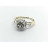 A 9carat gold ring set with a cluster of diamonds ring size J-K