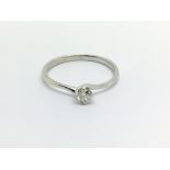 An unmarked possible 18carat white gold ring set w