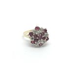 A 9carat gold ring set with a pattern of ruby and
