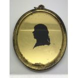 An antique Verre Eglomise silhouette pendant, appr