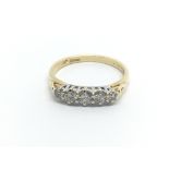 An 18carat gold ring set with five diamonds ring size O-P