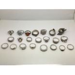 A collection of mixed silver rings.