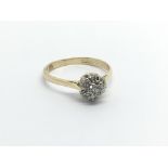 An 18carat gold ring set with a cluster of diamonds ring size. M.