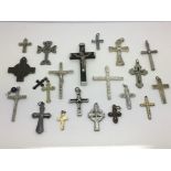 A collection of crucifix pendants.