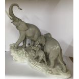 A large Lladro porcelain figure of an African elephant family. 41cm x 38cm.