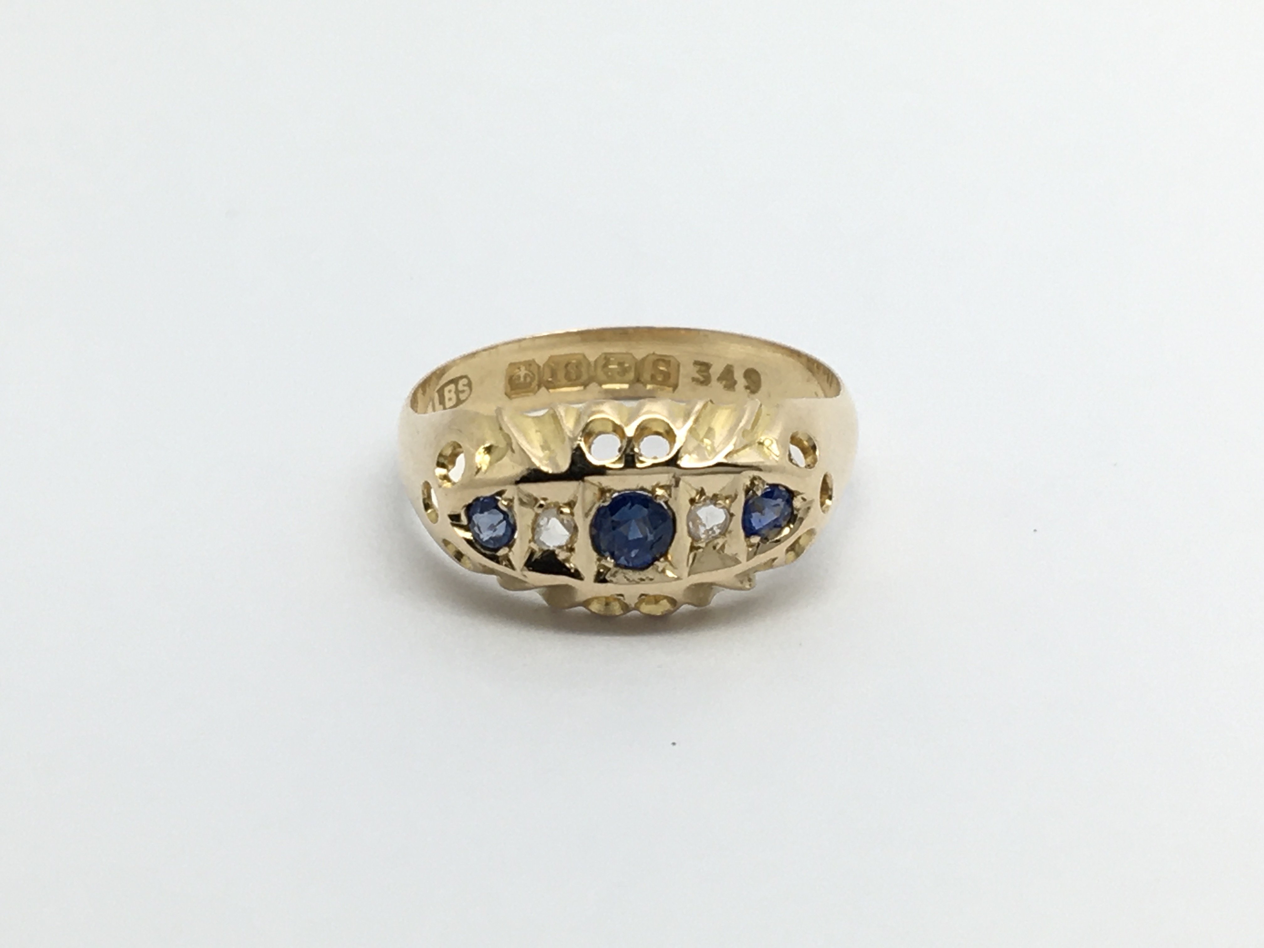 A 1920s 18carat gold ring set with three sapphire