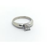 A 14carat gold ring set with a square pattern of Princess cut diamonds. Approximately 0.25 of a