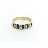 A 14carat gold ring set with alternating sapphire