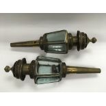 A pair of brass coaching lamps.