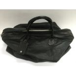 A good quality black leather holdall, as new.