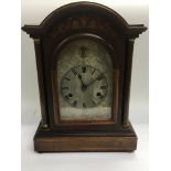 An Edwardian inlaid mahogany mantle clock with inl