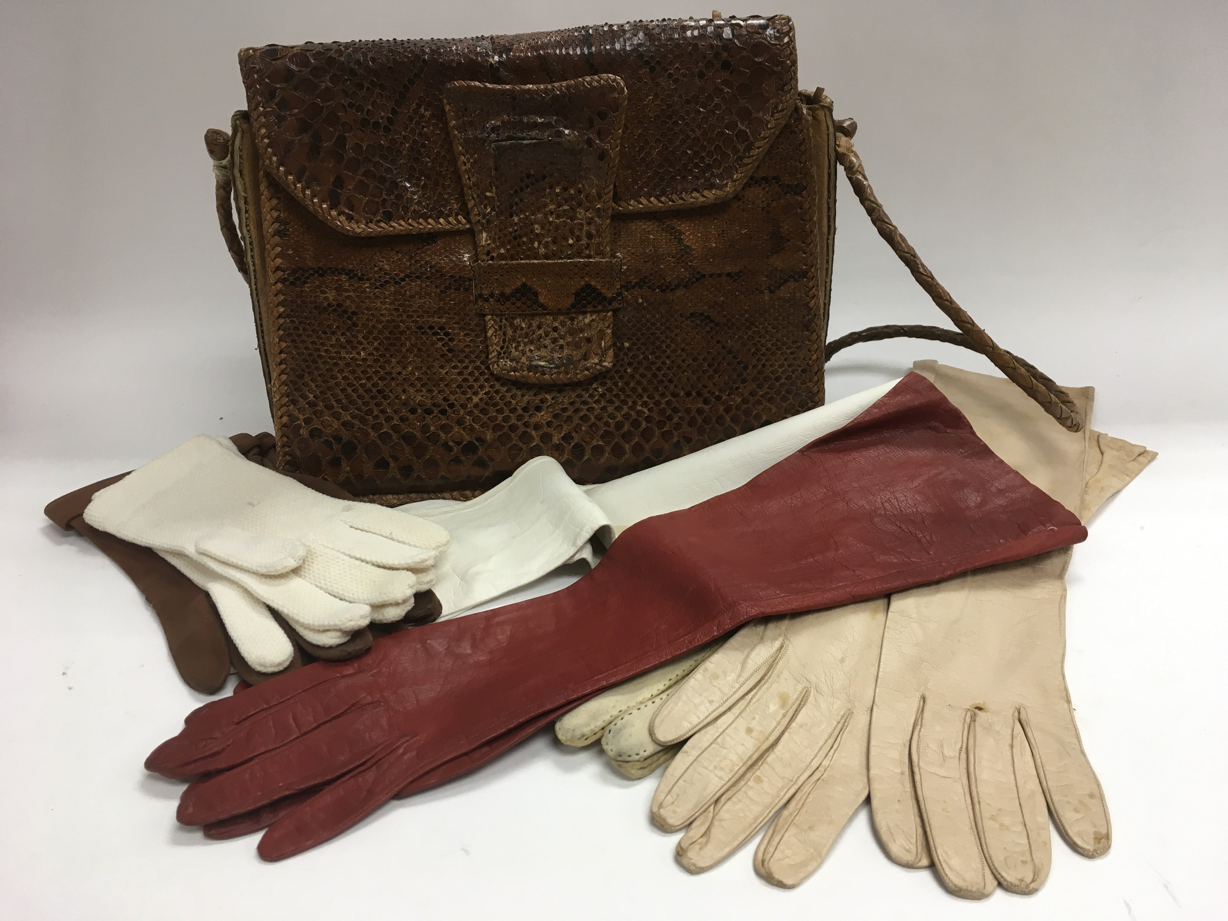 A vintage snakeskin handbag and six pairs of vinta