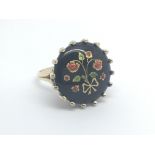A 9carat gold ring set with enamelled jet. Ring si