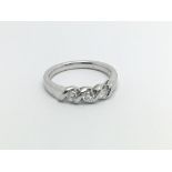An unmarked white gold ring Possibly 18carat set w