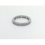 An 18carat white gold eternity ring set with a row