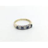 An 18carat gold ring set with alternating sapphire